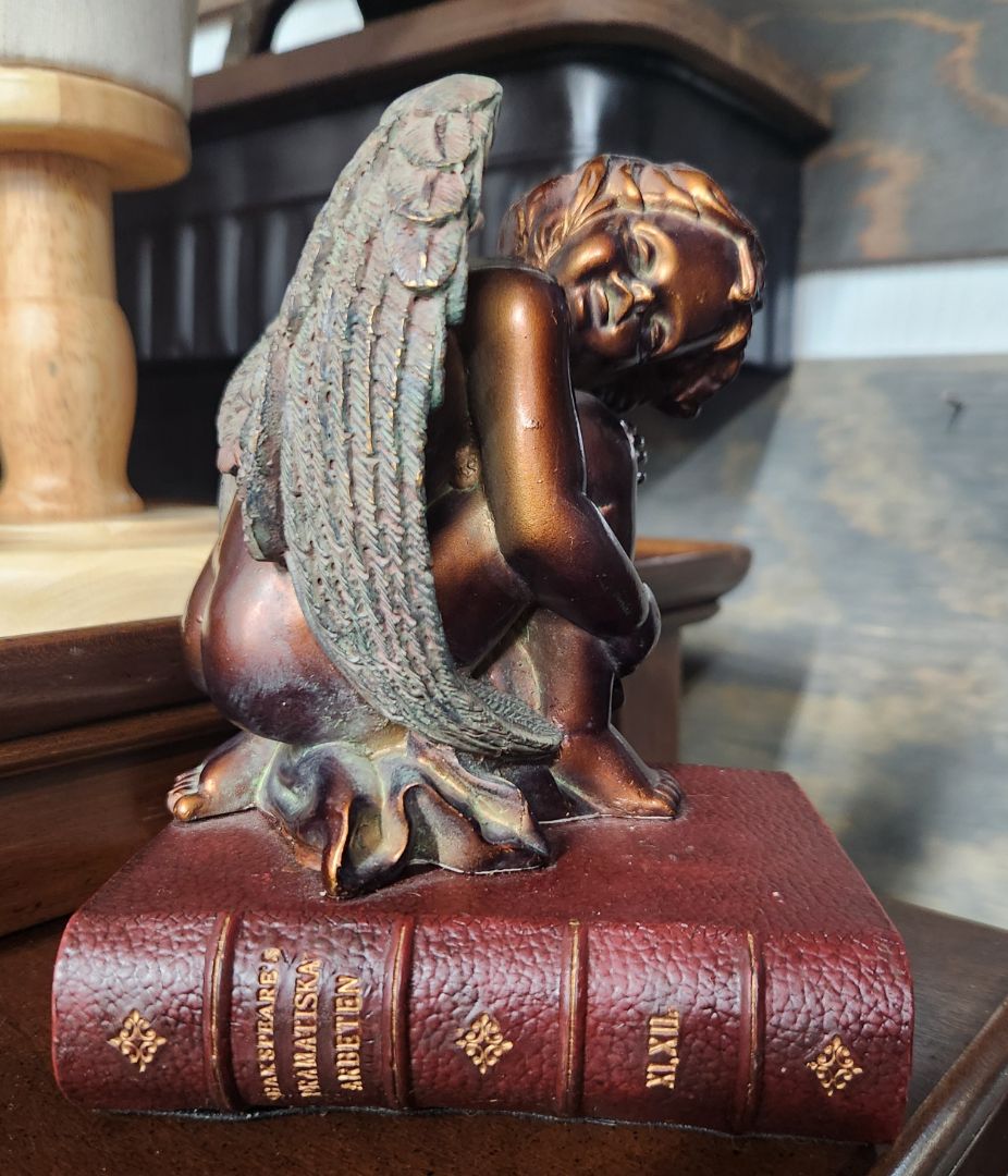 Cherub Figurine on Book
