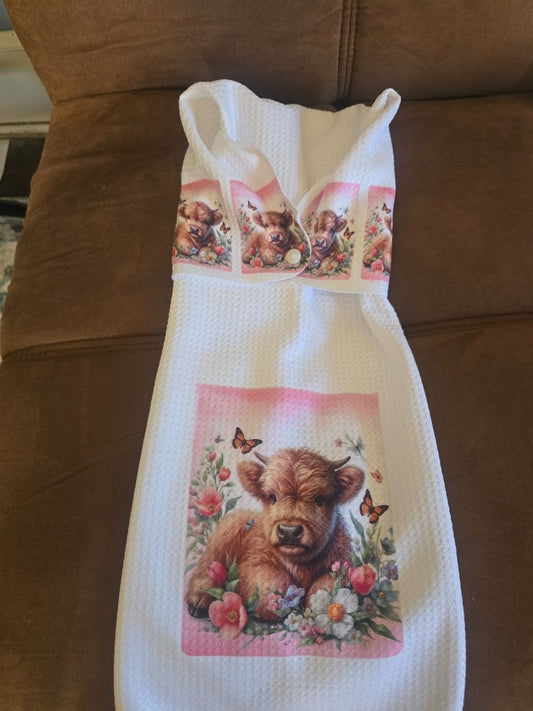 Hand towel with snap Cow laying in spring flowers