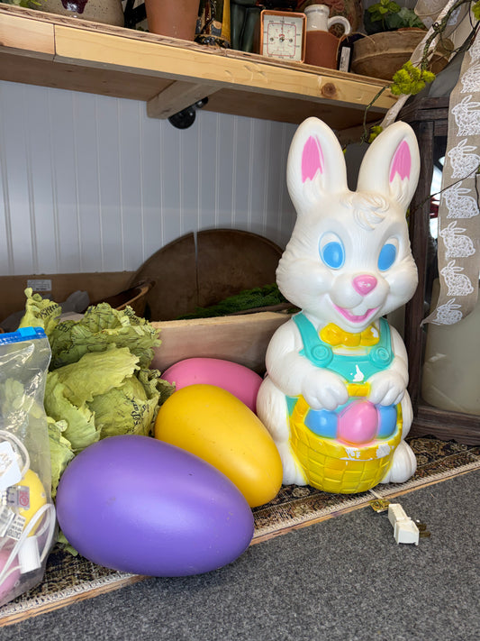 white vintage vintage bunny with three eggs