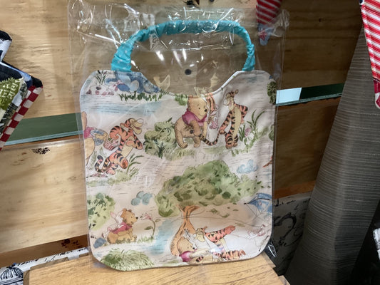 Tan “Winnie the Pooh” Bib