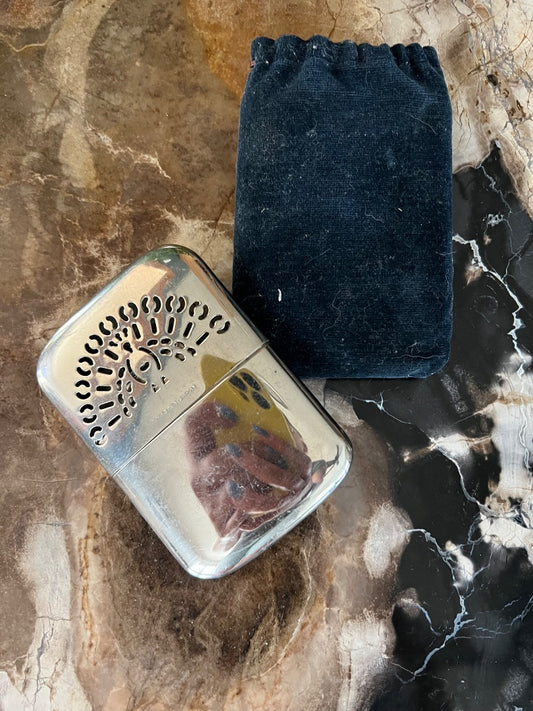 vintage Peacock brand pocket hand warmer