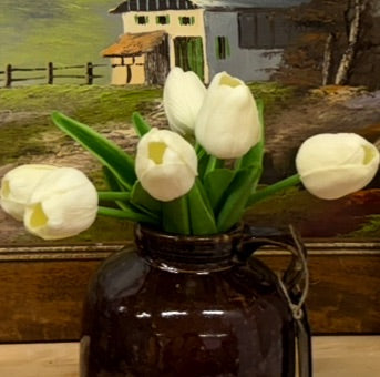 brown antique crock with tulips