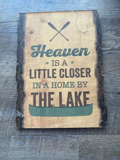 Wooden sign Heaven is a little closer in a home by the lake