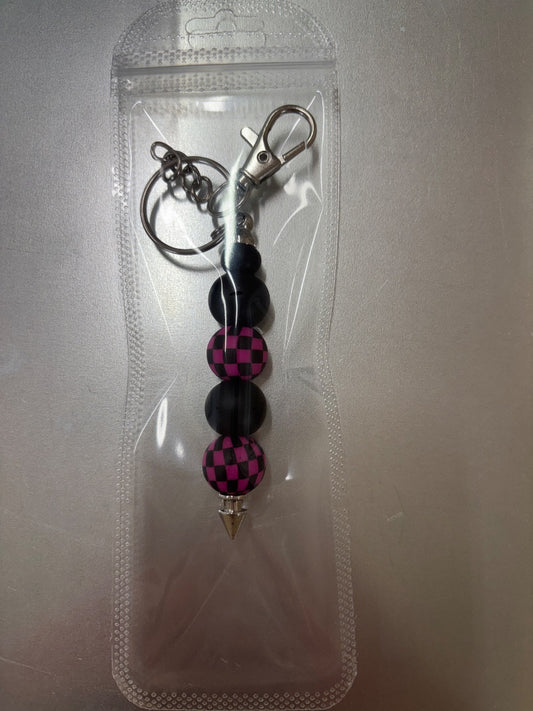 pink checkered beaded keychain Amira’s dog treats